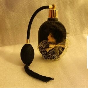 NOS 1970's Vintage Art Perfume Bottle in Black with a Woman's Face. NEVER USED.